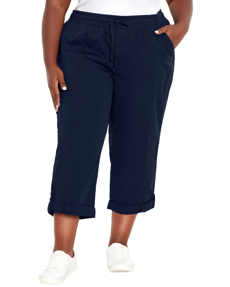 Front of a model wearing a size 26 CAPRI CTN ROLL UP in Navy by avenue. | dia_product_style_image_id:293496